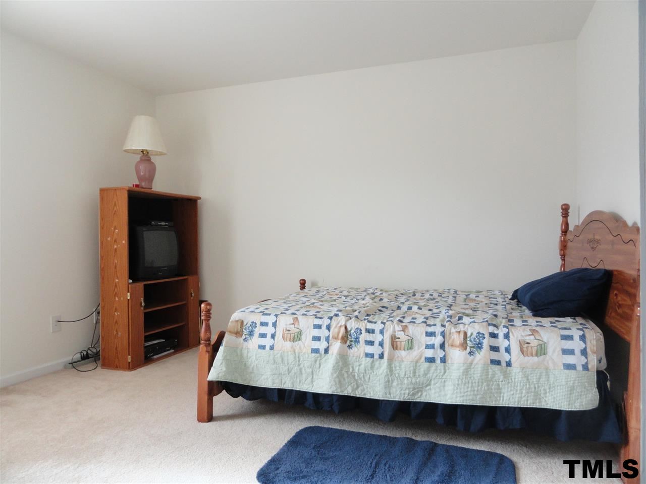 904 Morning Still Court Rolesville, NC 27571 - Photo 18 of 25 a bedroom with a bed and a window