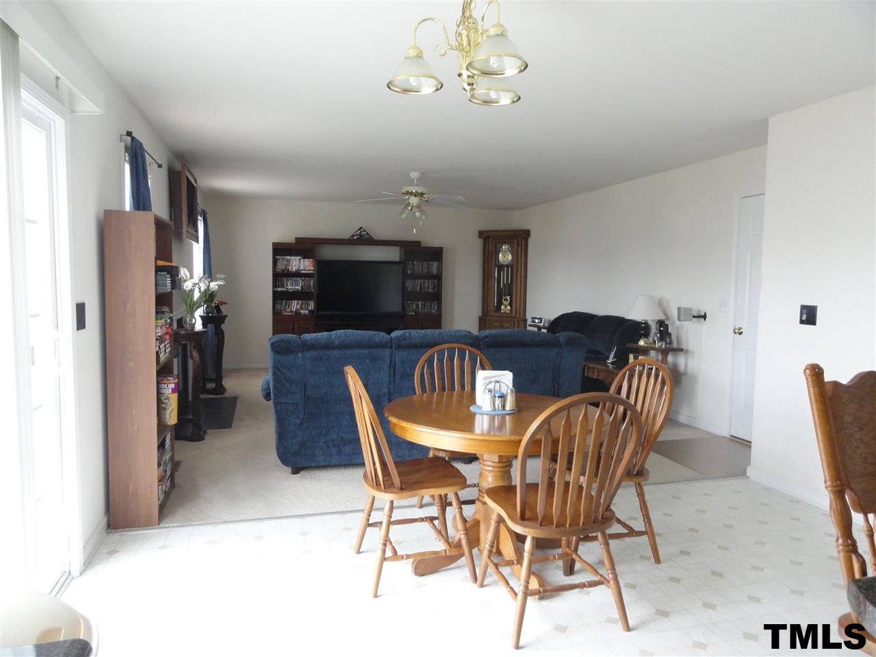 904 Morning Still Court Rolesville, NC 27571 - Photo 3 of 25 a view of a dining room with furniture