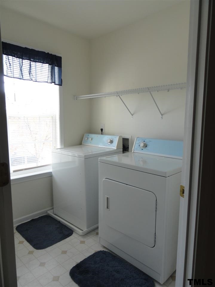 904 Morning Still Court Rolesville, NC 27571 - Photo 22 of 25 a utility room with dryer and washer