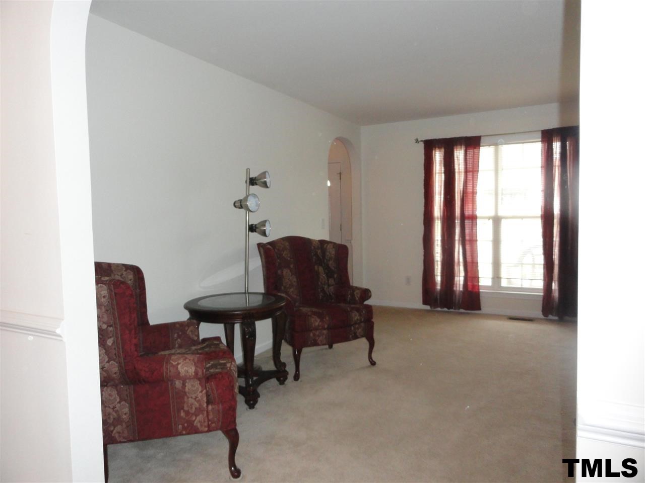 904 Morning Still Court Rolesville, NC 27571 - Photo 10 of 25 a living room with furniture and a window