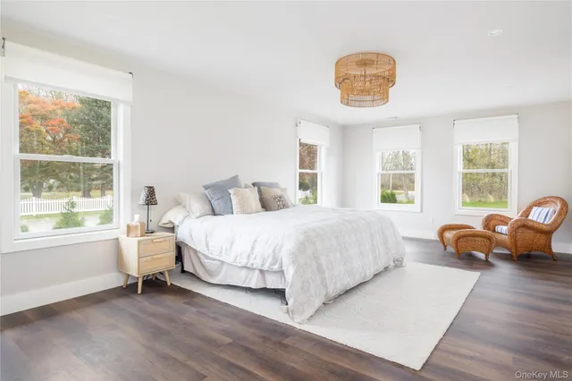 a bedroom with a bed a table and chair