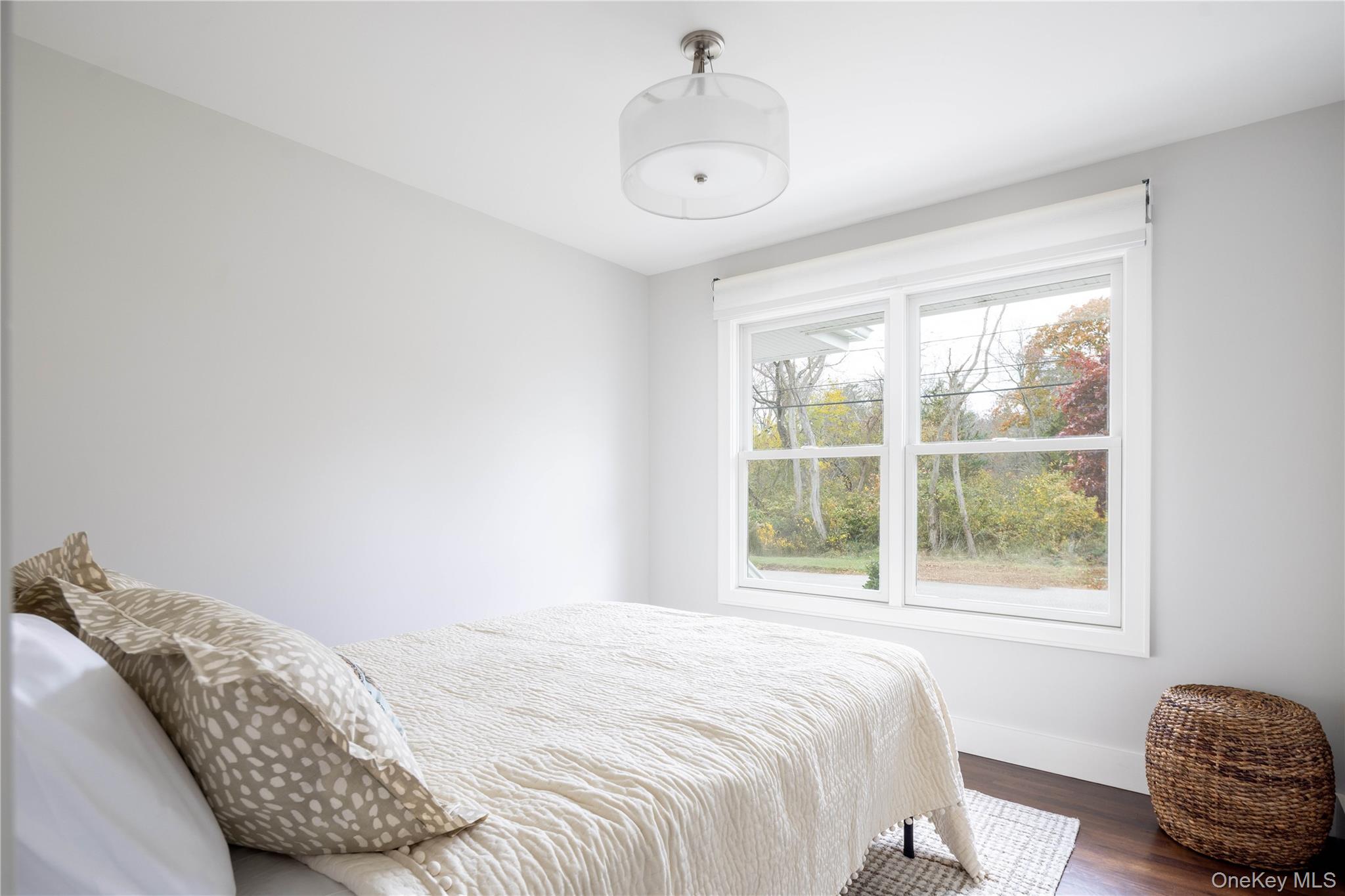 1995 Ruth Road Mattituck, NY 11952 - Photo 17 of 32 a bedroom with a bed and a window