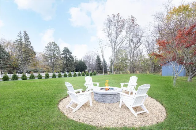 a view of a table and chairs in the garden