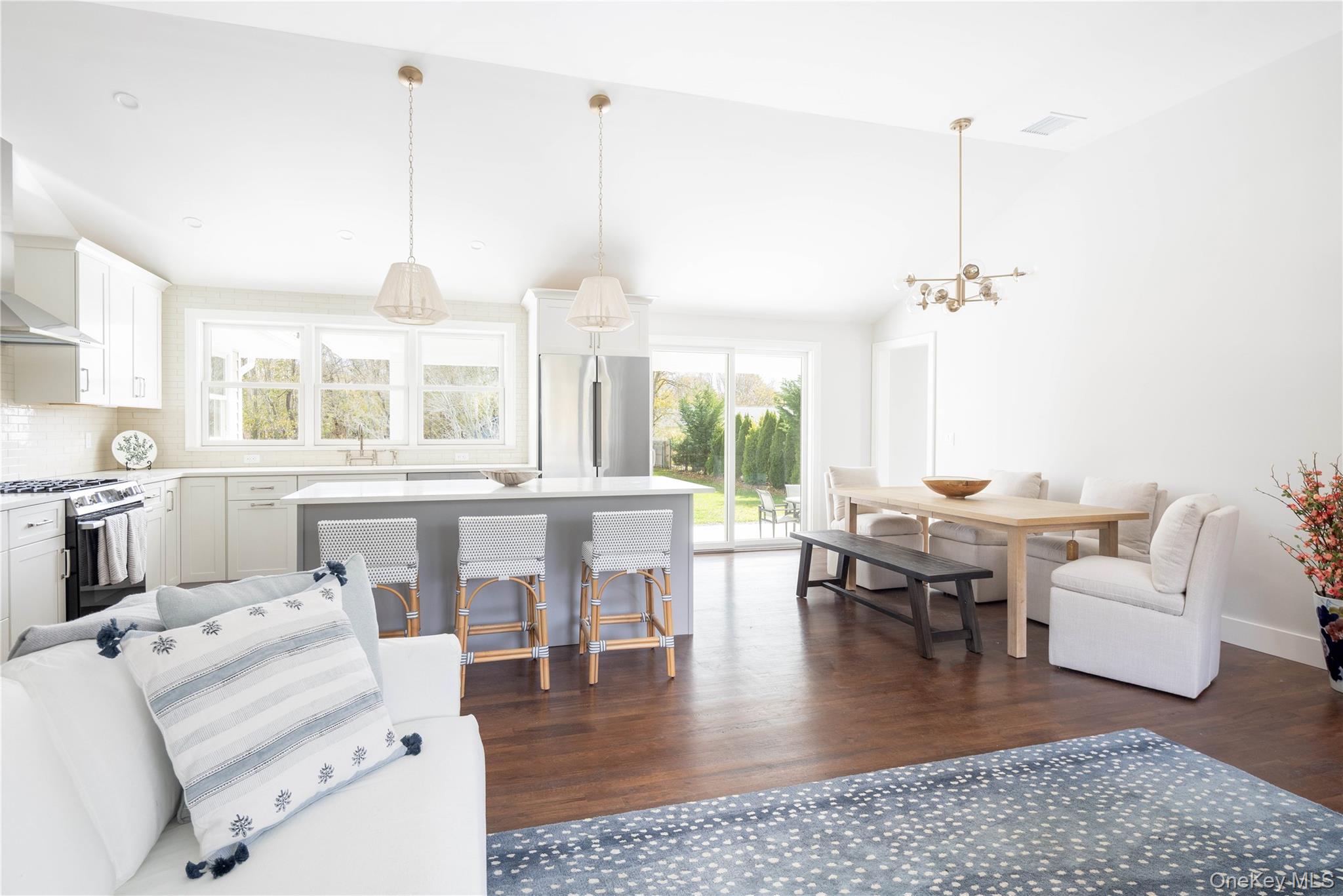 1995 Ruth Road Mattituck, NY 11952 - Photo 5 of 32 a living room with lots of furniture and a chandelier