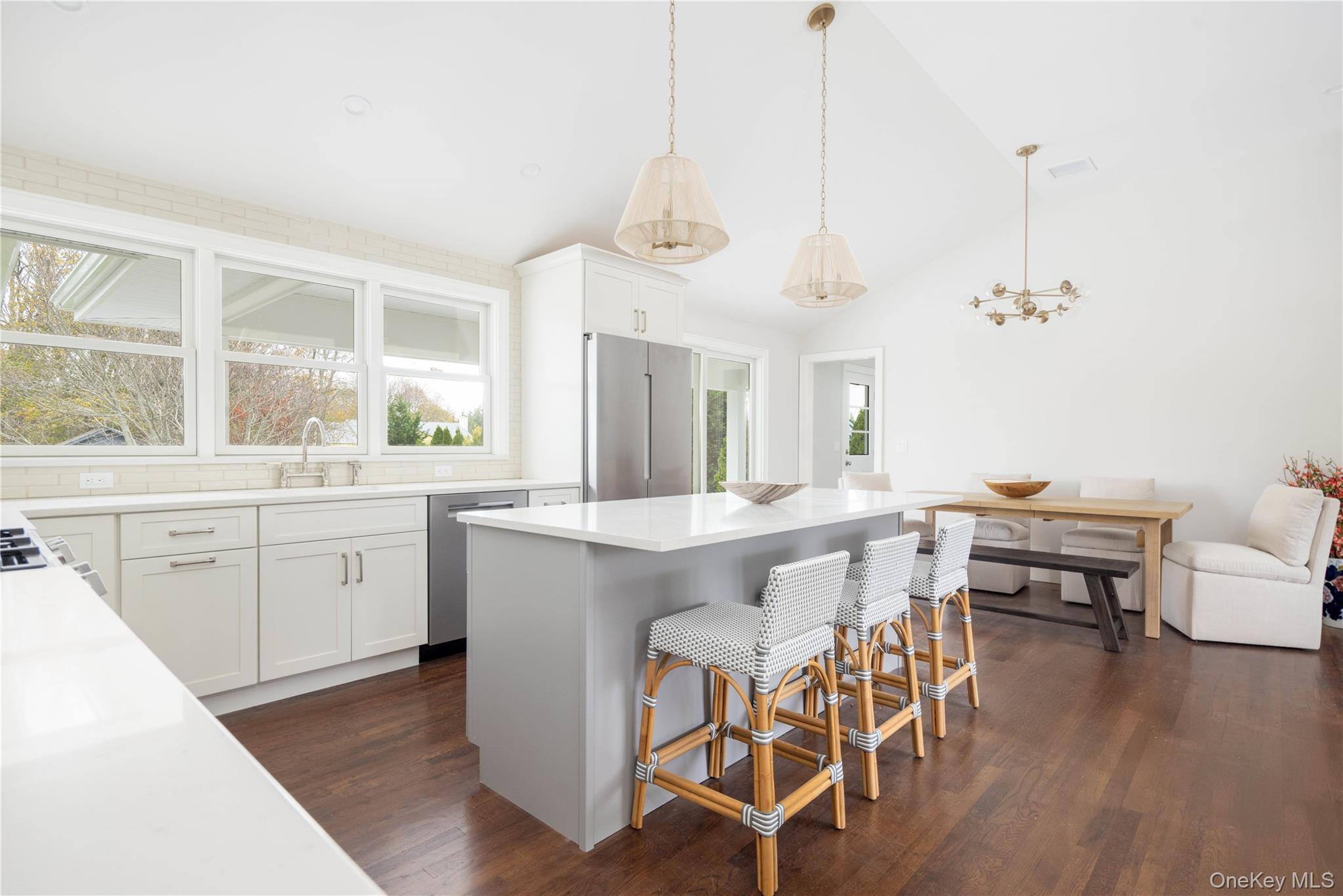 1995 Ruth Road Mattituck, NY 11952 - Photo 7 of 32 a kitchen with a dining table chairs wooden floor and appliances