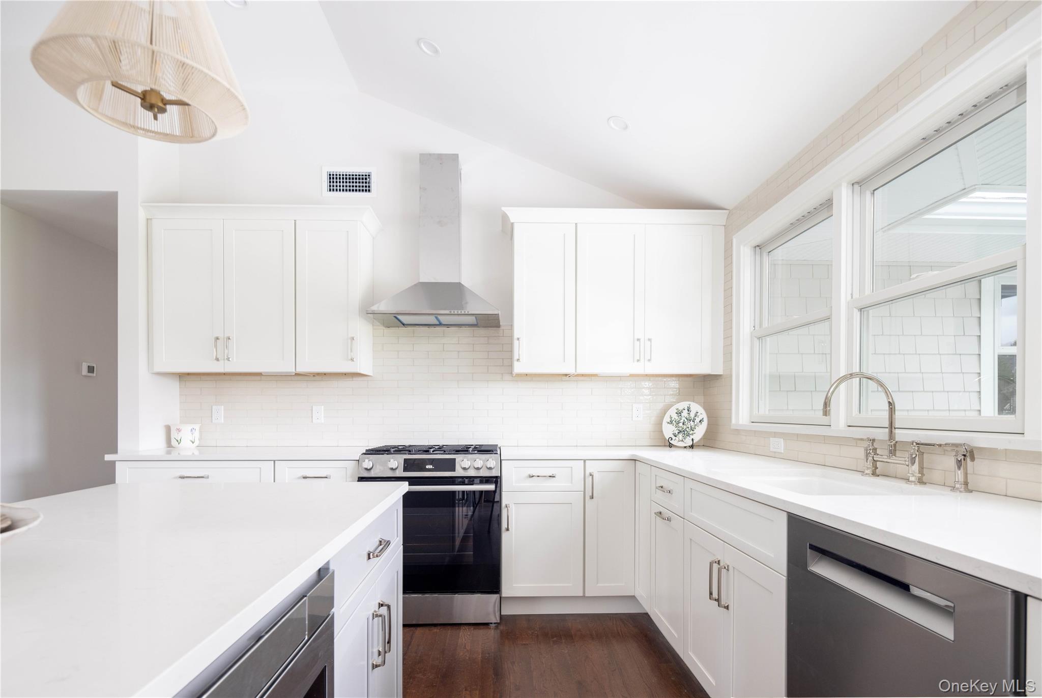 1995 Ruth Road Mattituck, NY 11952 - Photo 9 of 32 a kitchen with white cabinets and white appliances