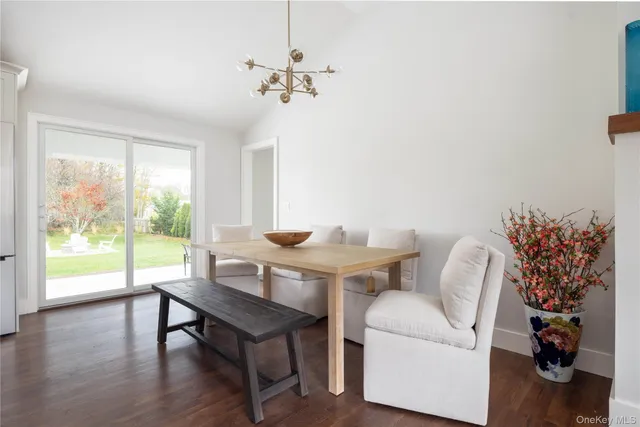 a view of a livingroom with furniture and a potted plant