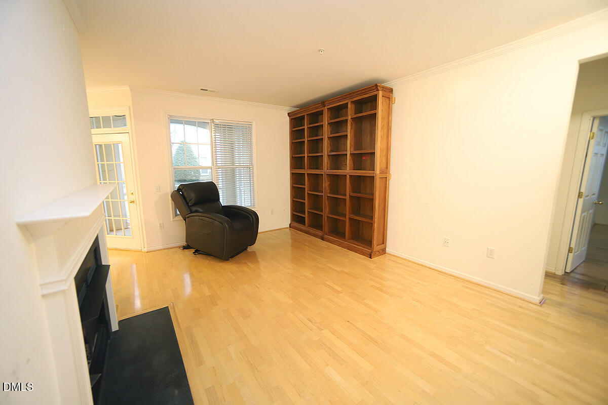 3161 Hemlock Forest Circle, Unit 101 Raleigh, NC 27612 - Photo 6 of 21 a view of a livingroom with furniture and an empty room