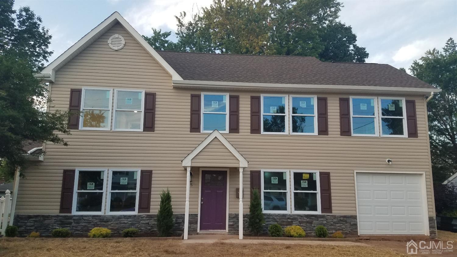 15 Dayton Road Edison, NJ 08817 - Photo 1 of 28 a front view of a house with a yard
