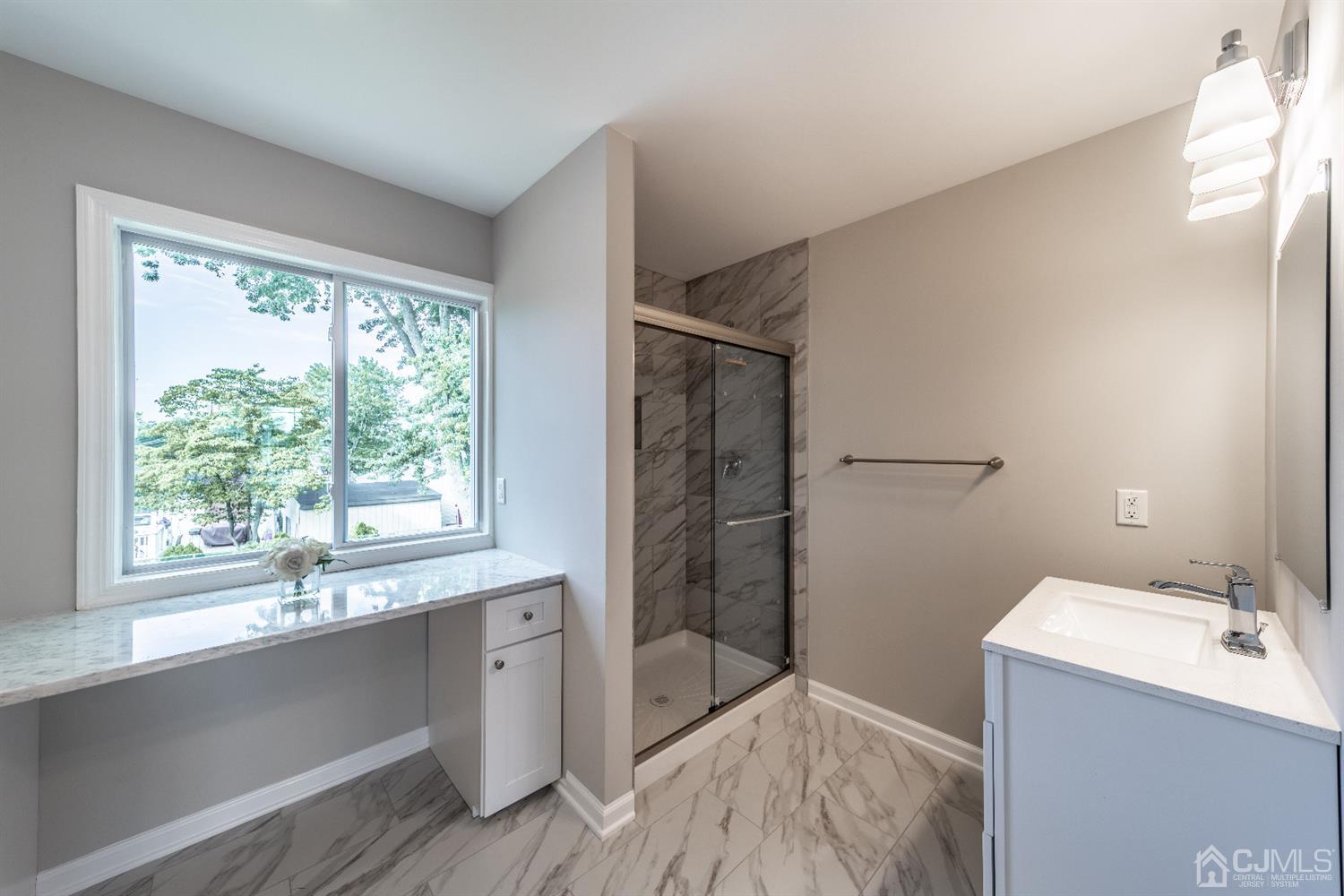 15 Dayton Road Edison, NJ 08817 - Photo 18 of 28 a bathroom with a sink and a shower