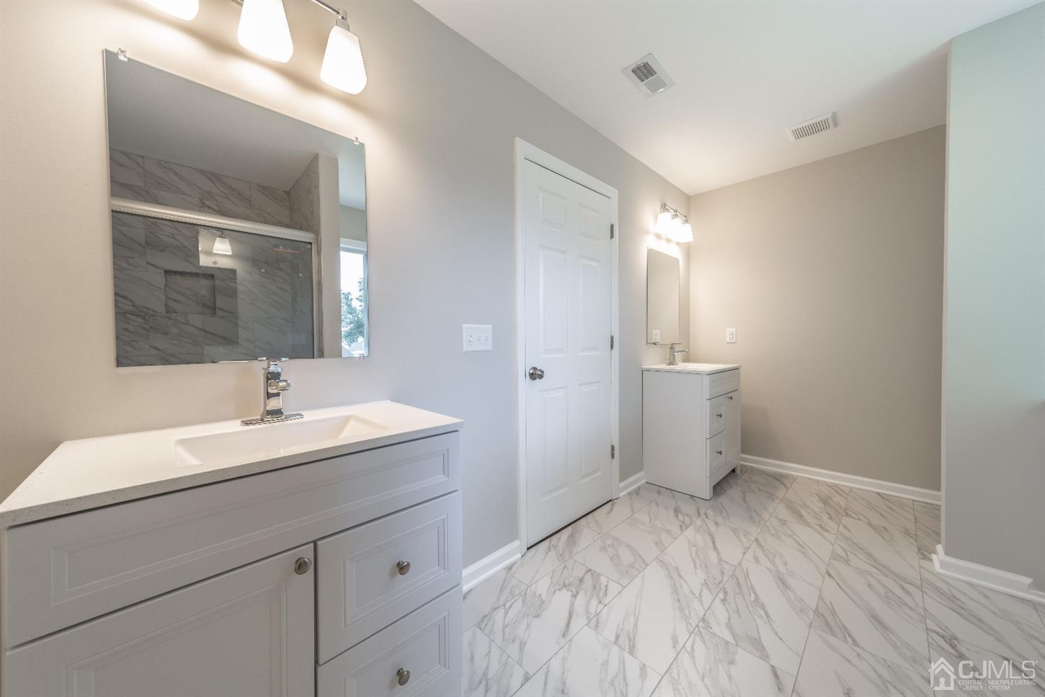 15 Dayton Road Edison, NJ 08817 - Photo 19 of 28 a bathroom with a sink and a mirror