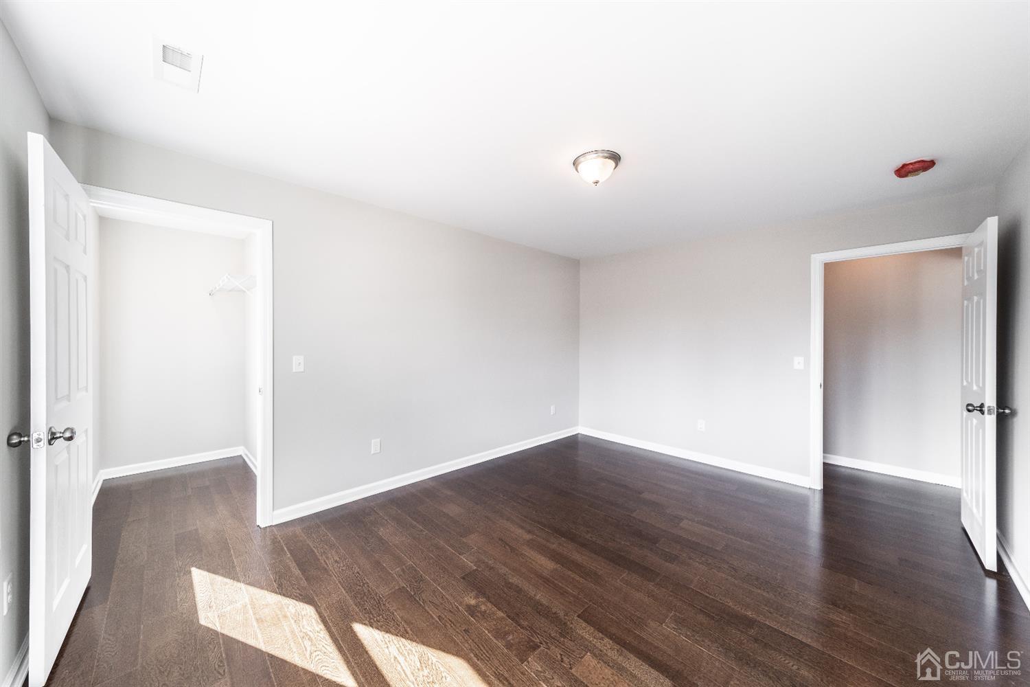 15 Dayton Road Edison, NJ 08817 - Photo 22 of 28 a view of an empty room with wooden floor