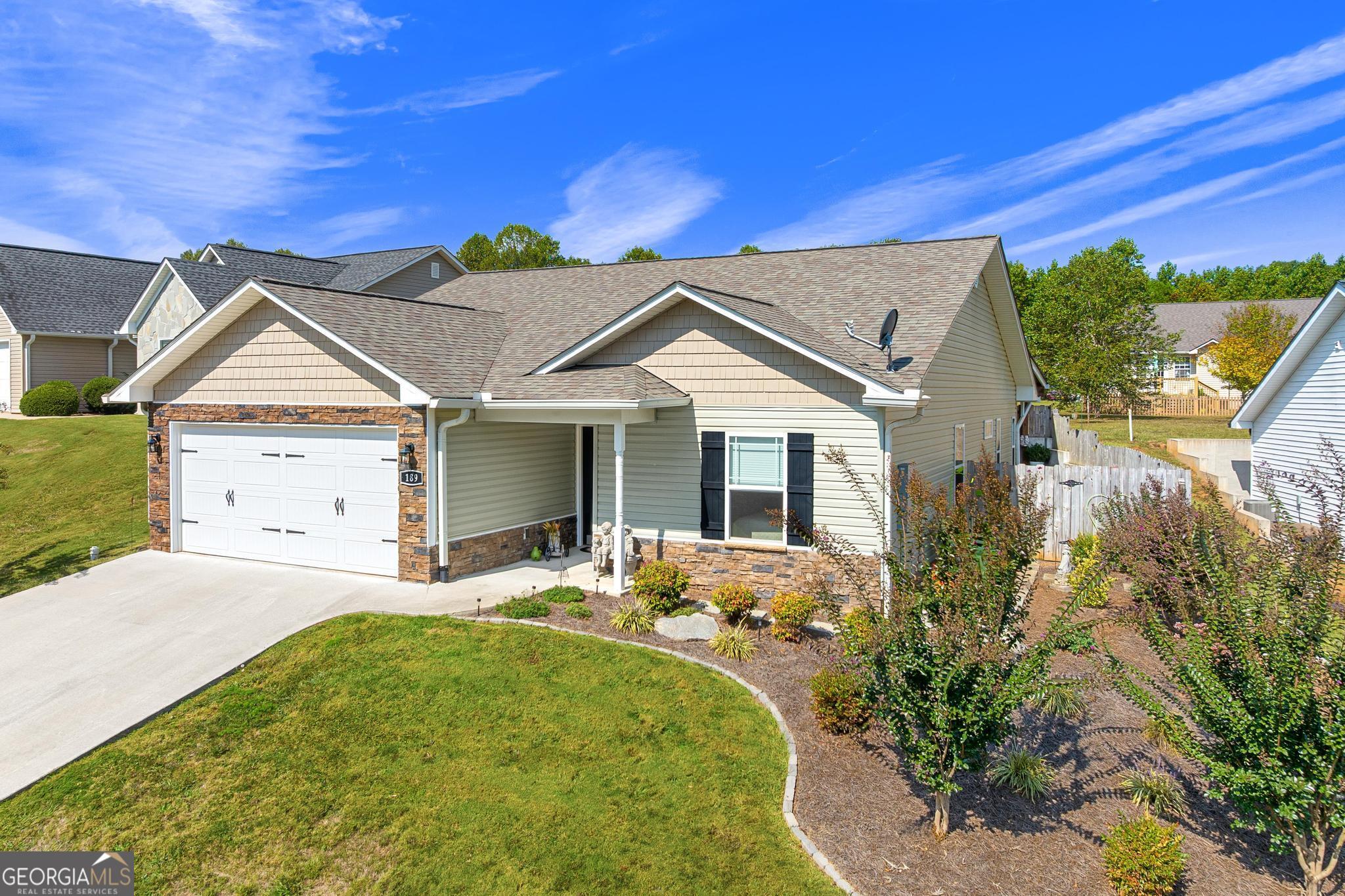 189 Legacy Drive Demorest, GA 30535 - Photo 1 of 1 a view of a house with a small yard and potted plants