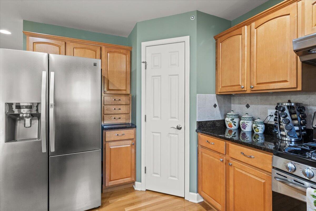 1270 East Greenview Place Crown Point, IN 46307 - Photo 12 of 44 a kitchen with stainless steel appliances granite countertop a refrigerator and a stove top oven