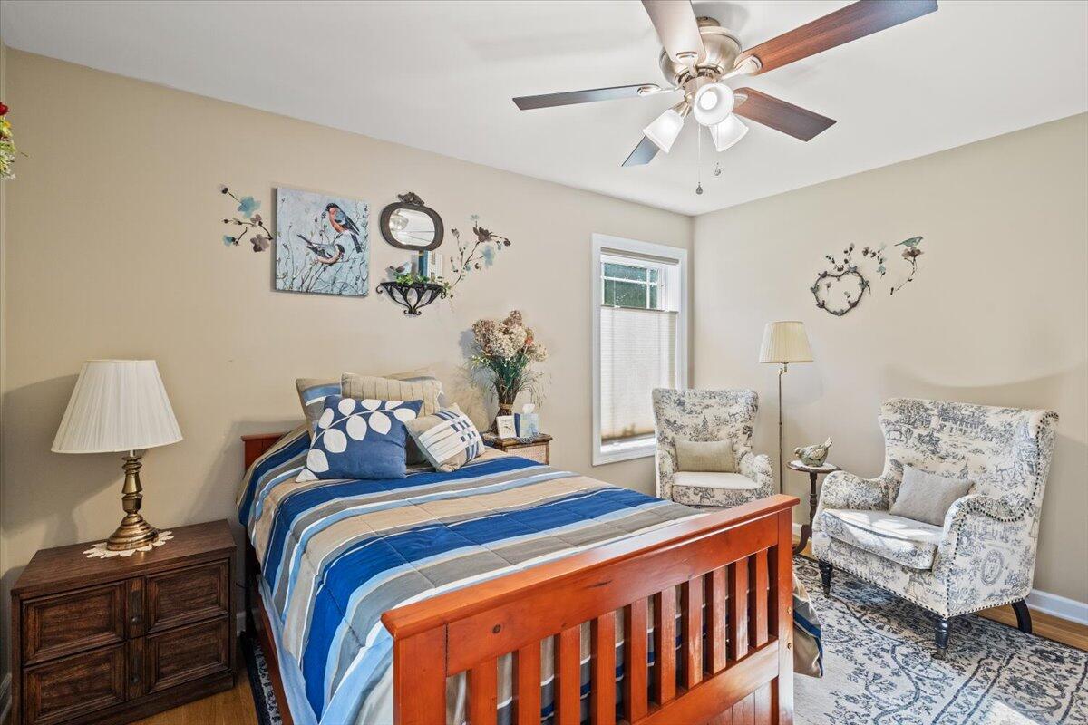 1270 East Greenview Place Crown Point, IN 46307 - Photo 20 of 44 a bedroom with a bed and a lamp