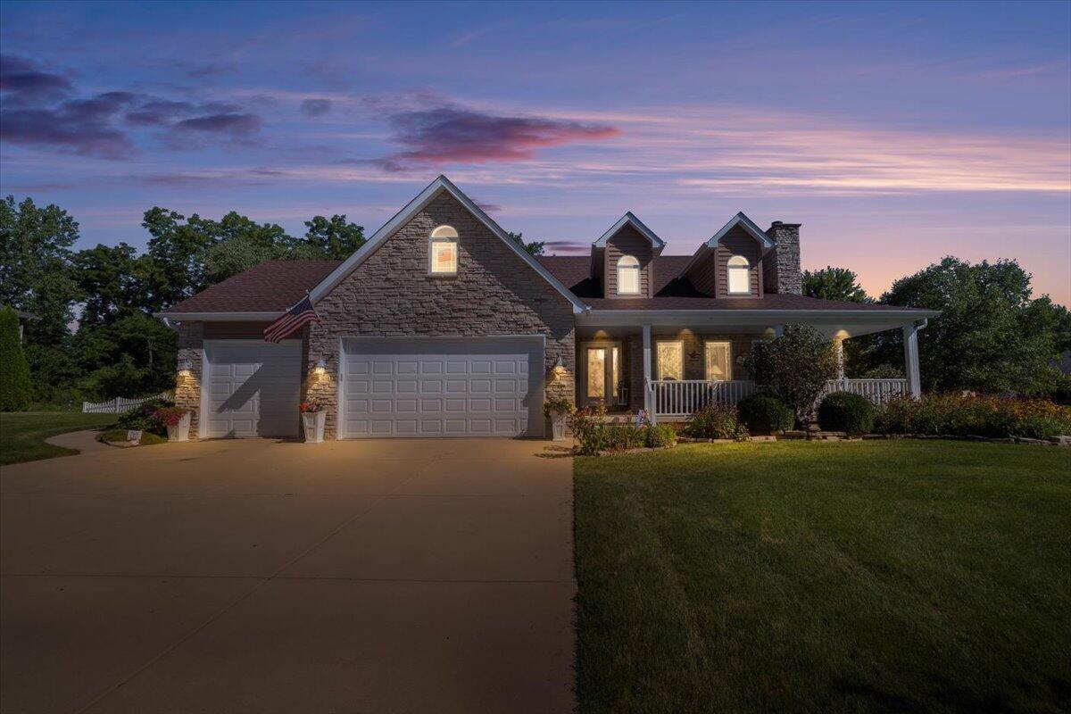 1270 East Greenview Place Crown Point, IN 46307 - Photo 2 of 44 a front view of house with yard and trees in the background