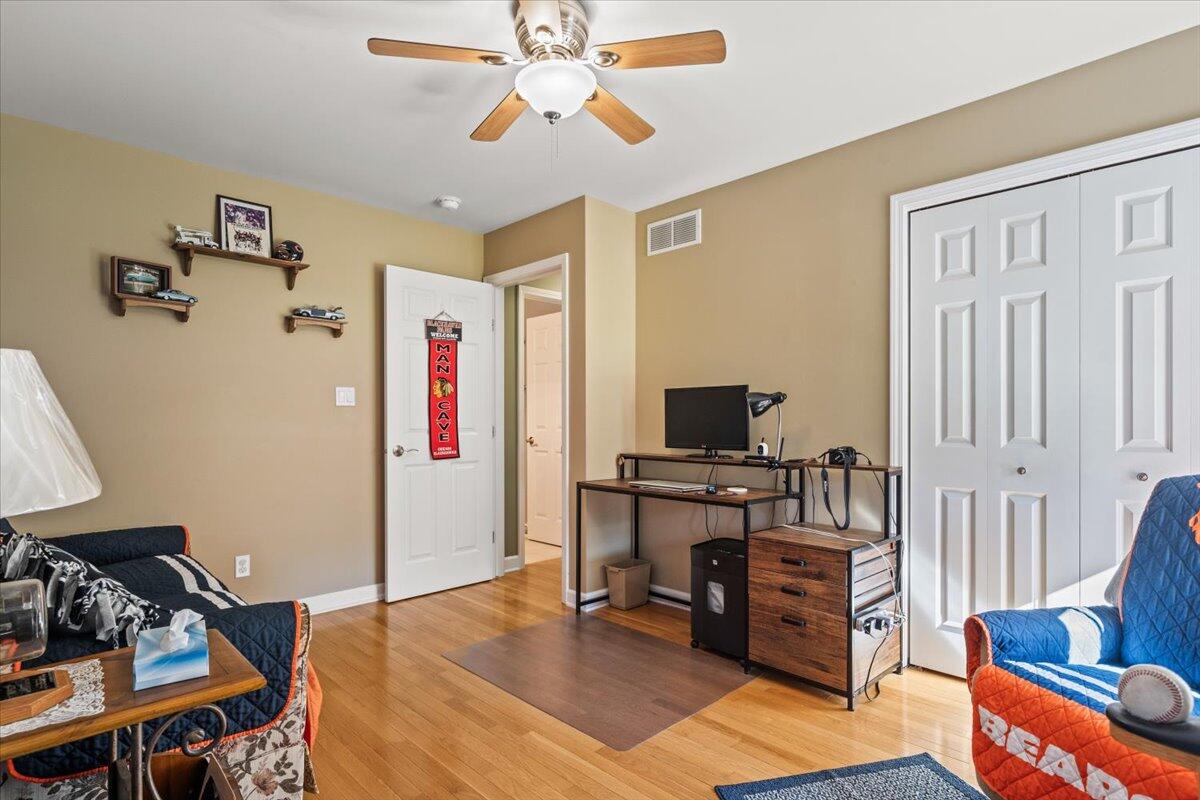 1270 East Greenview Place Crown Point, IN 46307 - Photo 22 of 44 a bedroom with furniture and wooden floor
