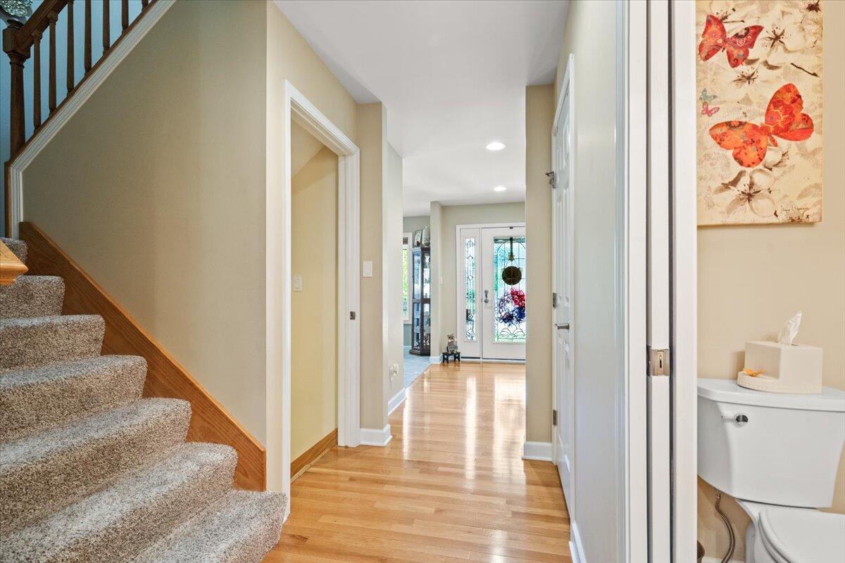 1270 East Greenview Place Crown Point, IN 46307 - Photo 25 of 44 a view of a hallway with wooden floor and entryway