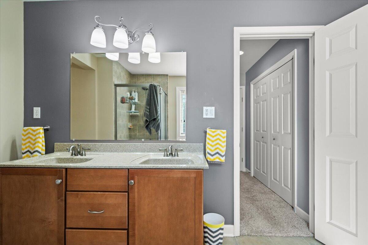 1270 East Greenview Place Crown Point, IN 46307 - Photo 29 of 44 a bathroom with a sink and a mirror