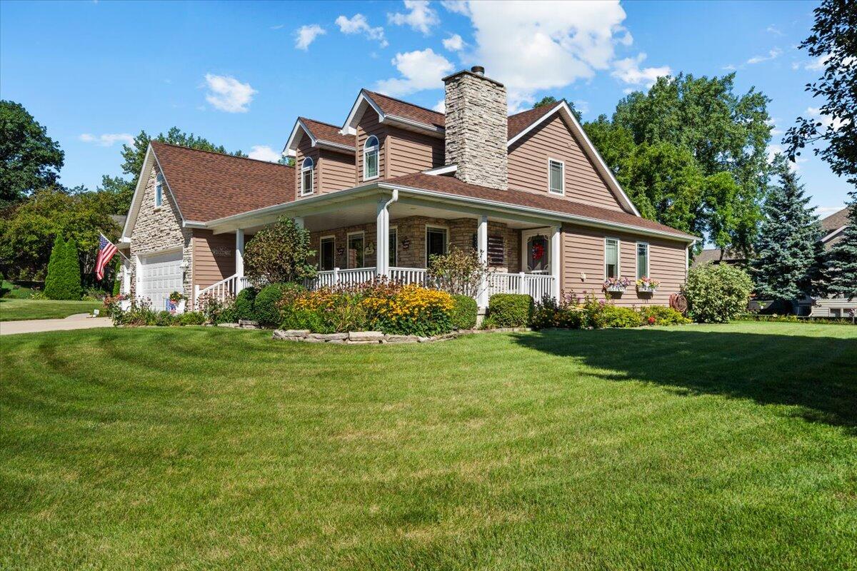 1270 East Greenview Place Crown Point, IN 46307 - Photo 3 of 44 a front view of a house with garden