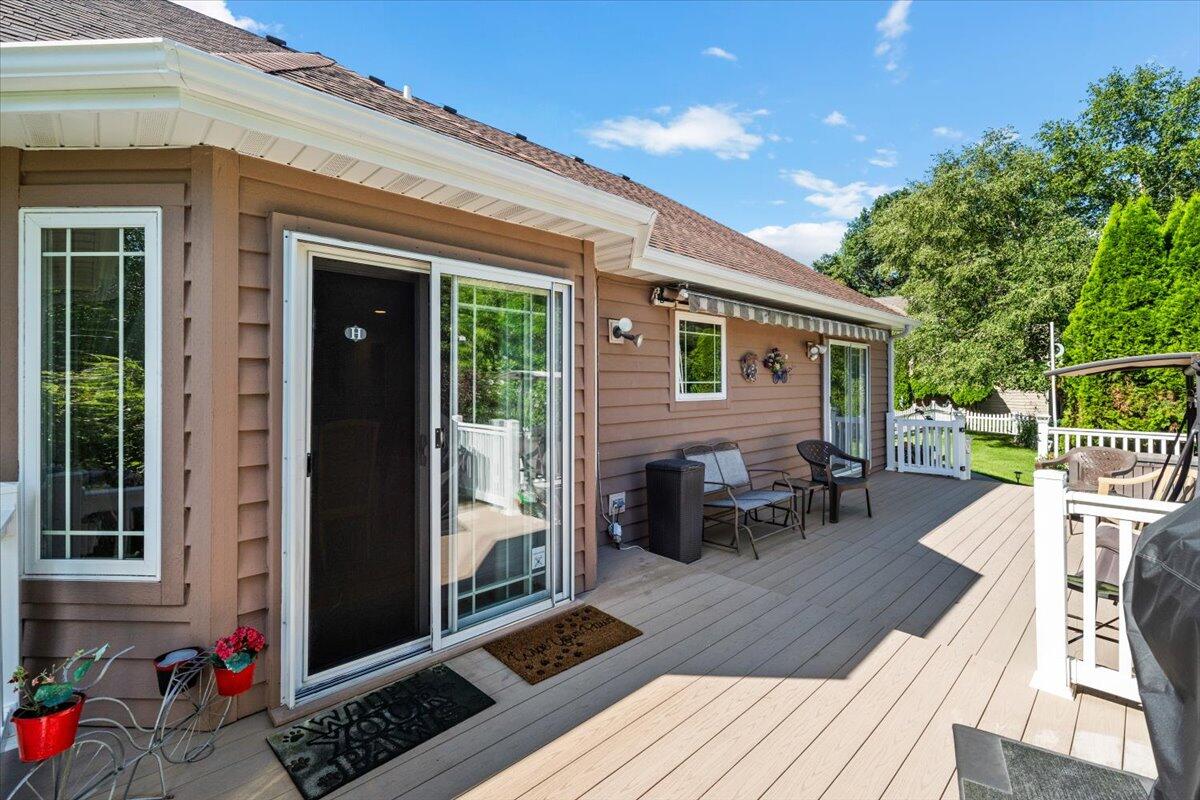 1270 East Greenview Place Crown Point, IN 46307 - Photo 44 of 44 a view of a patio with table and chairs with wooden floor and fence