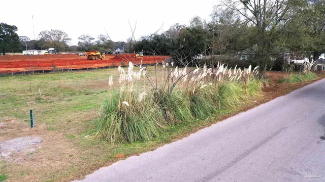a view of a lake with a yard