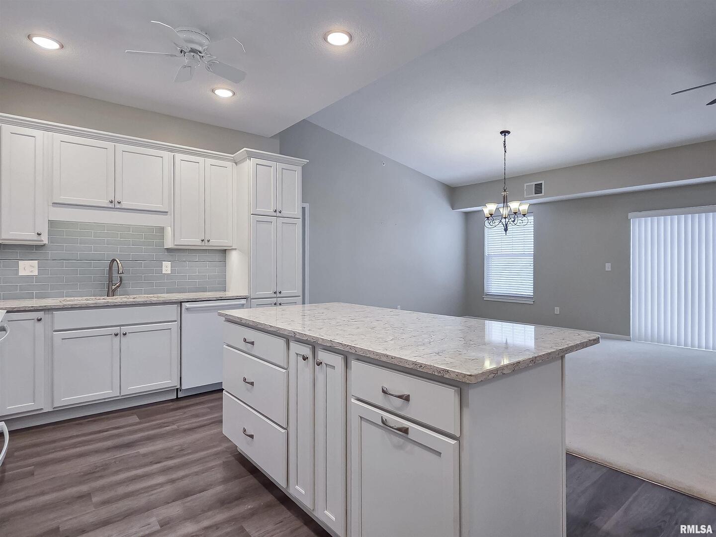 2592 Middle Road, Unit 313 Bettendorf, IA 52722 - Photo 13 of 52 a kitchen with white cabinets appliances and sink