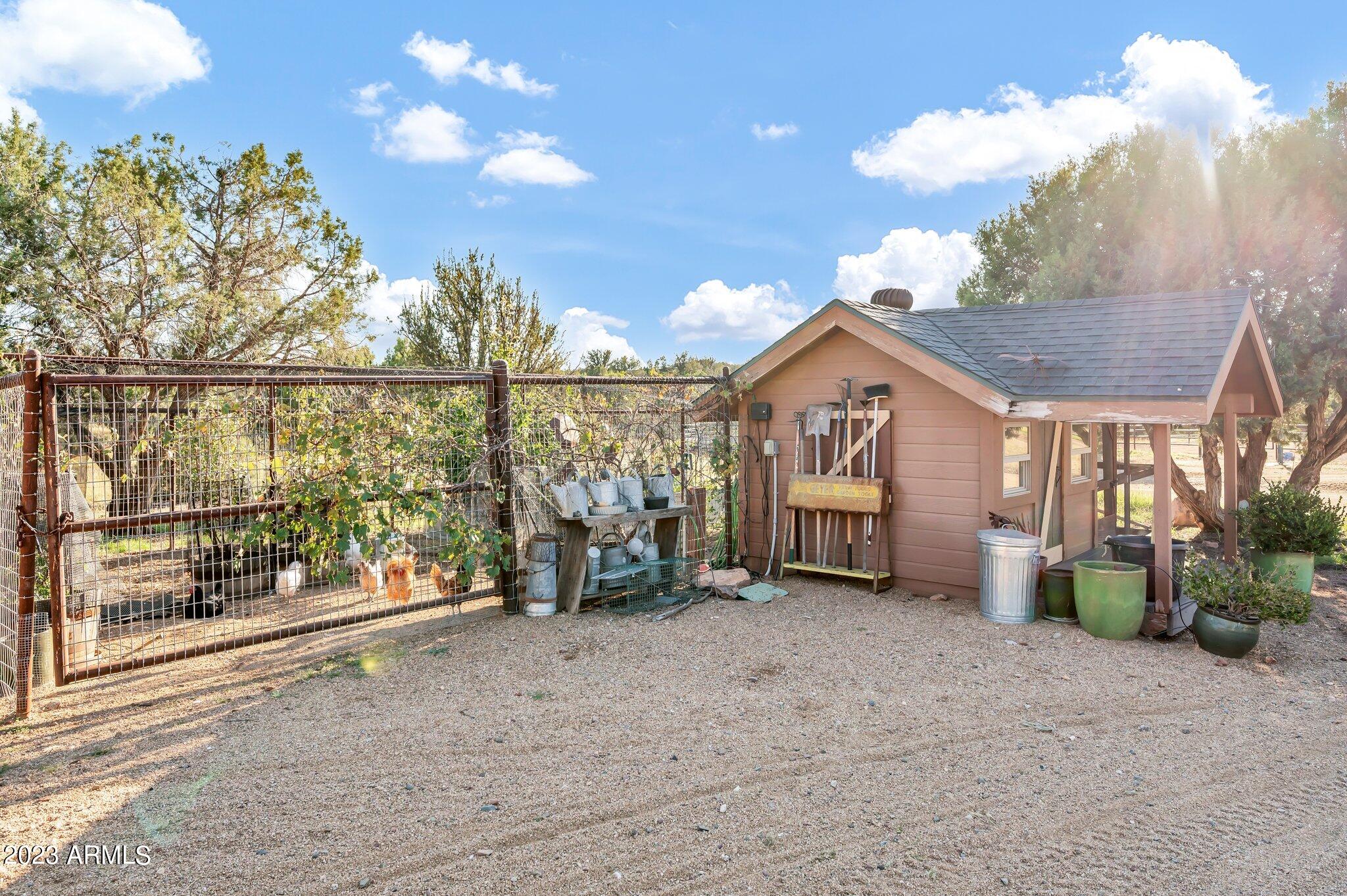 5801 Dillon Wash Road Prescott, AZ 86305 - Photo 116 of 169 111 - Chicken Coop and Garden Area
