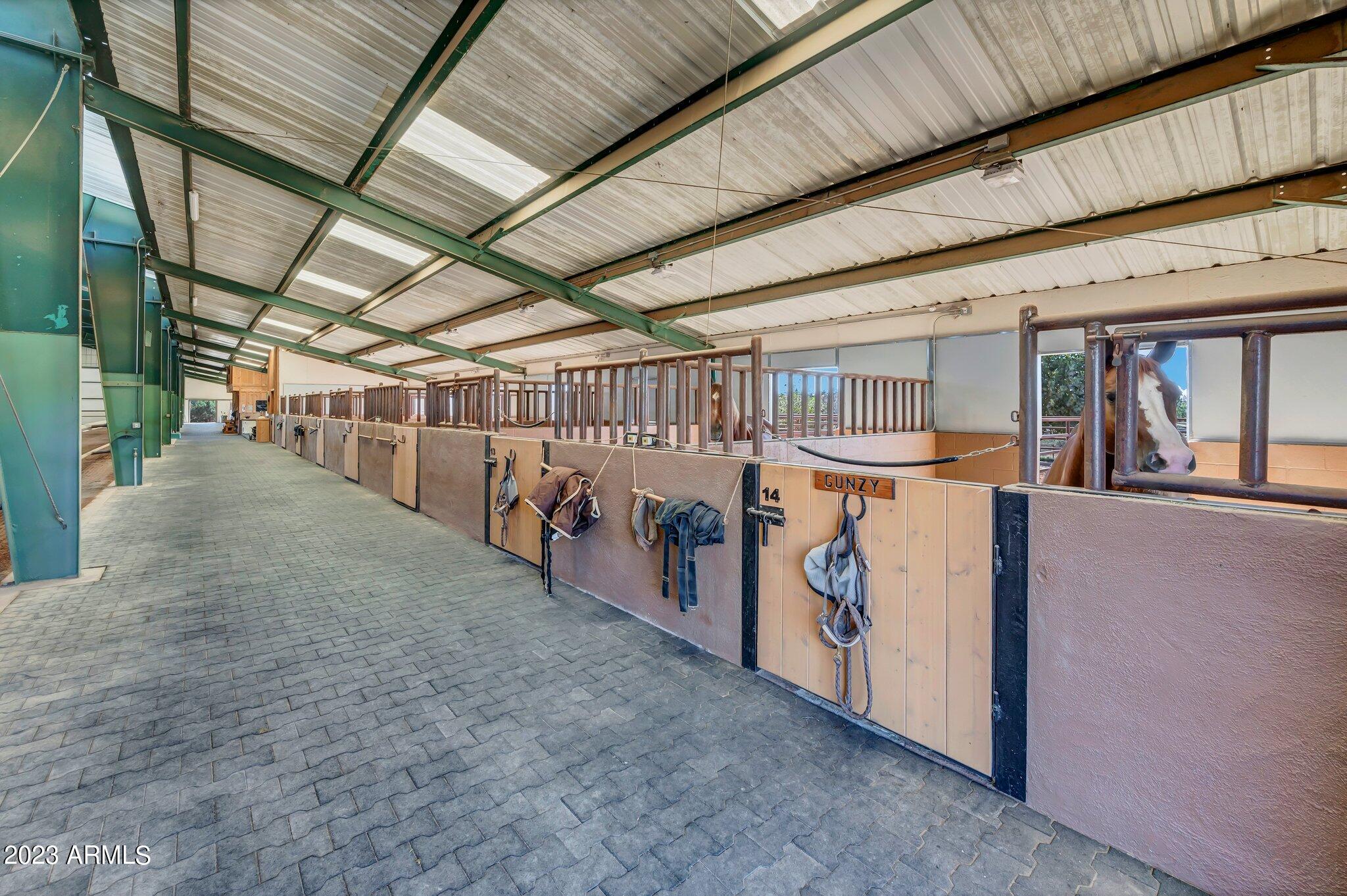5801 Dillon Wash Road Prescott, AZ 86305 - Photo 84 of 169 79 - Indoor Arena Horse Stalls