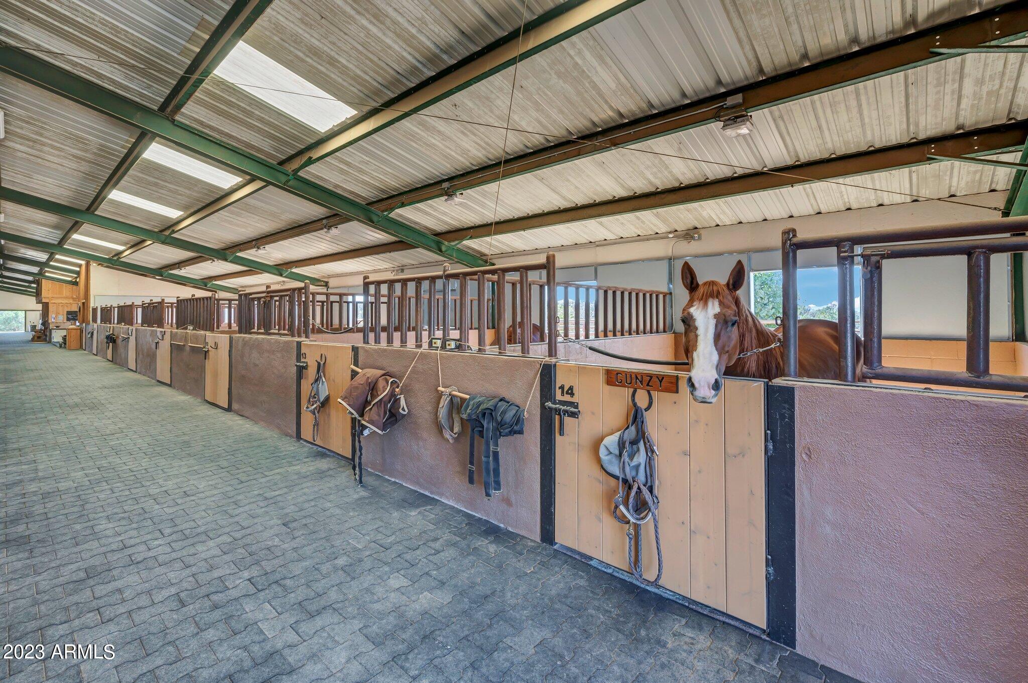 5801 Dillon Wash Road Prescott, AZ 86305 - Photo 85 of 169 80 - Indoor Arena Horse Stalls