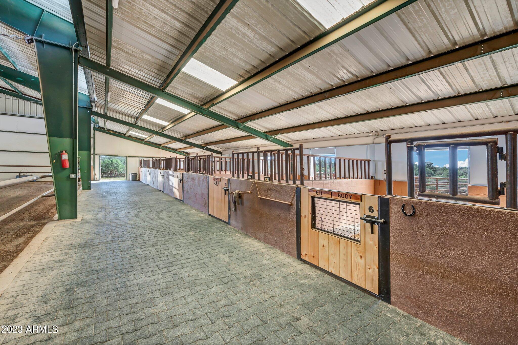 5801 Dillon Wash Road Prescott, AZ 86305 - Photo 89 of 169 84 - Indoor Arena Horse Stalls
