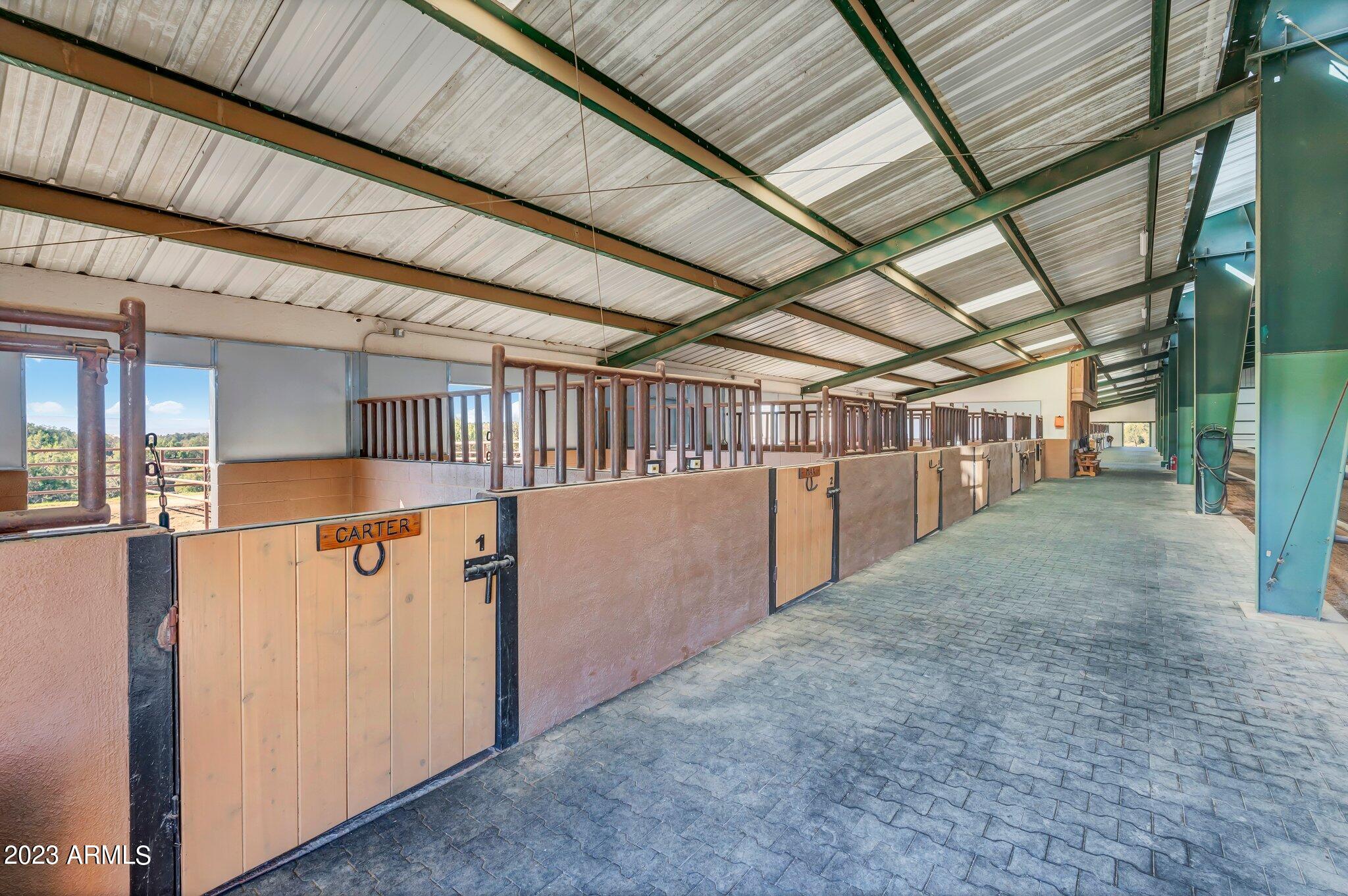 5801 Dillon Wash Road Prescott, AZ 86305 - Photo 90 of 169 85 - Indoor Arena Horse Stalls