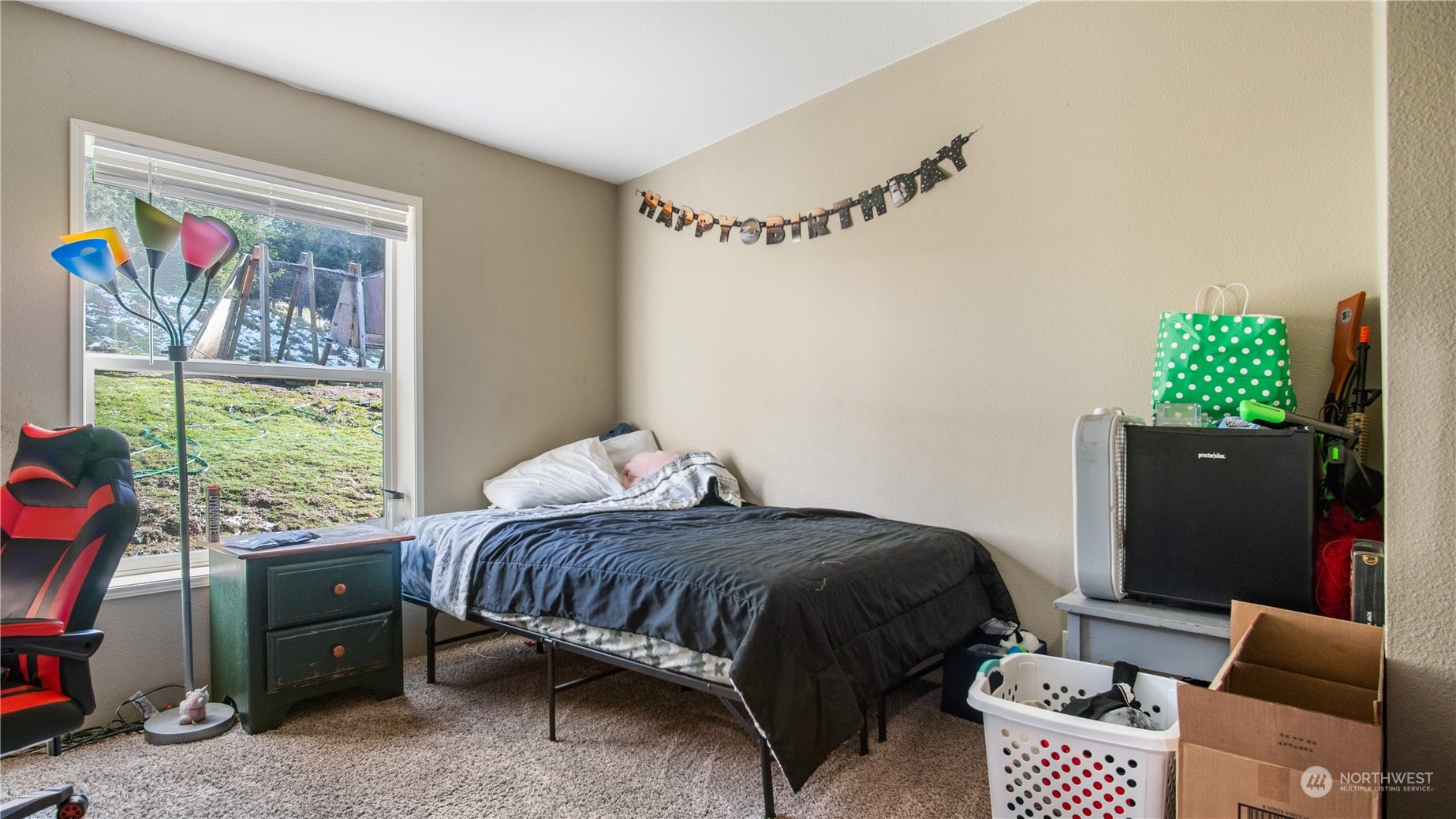 673 Curtis Hill Road, Unit G Chehalis, WA 98532 - Photo 17 of 25 a bedroom with a bed and a window