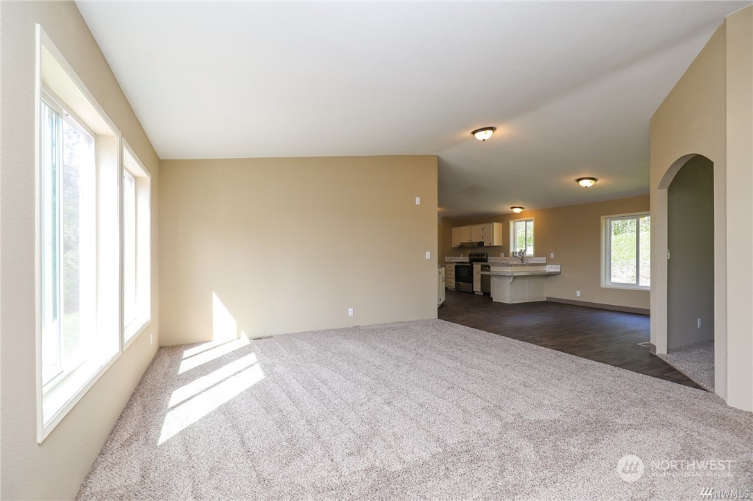 673 Curtis Hill Road, Unit G Chehalis, WA 98532 - Photo 7 of 25 a view of empty room with a fireplace