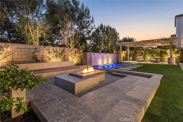 a view of a patio with a table and chairs