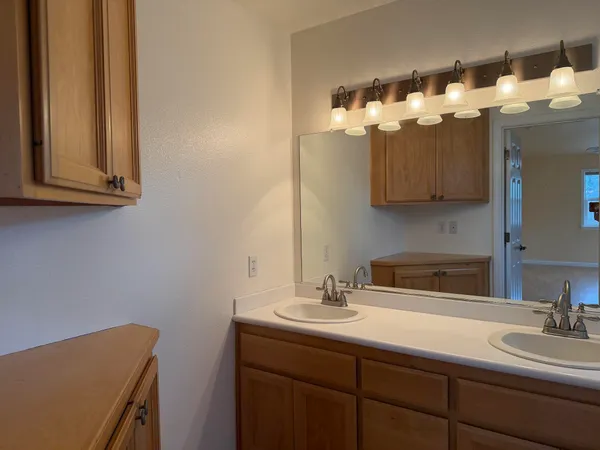 a view of a town with mountains in the background