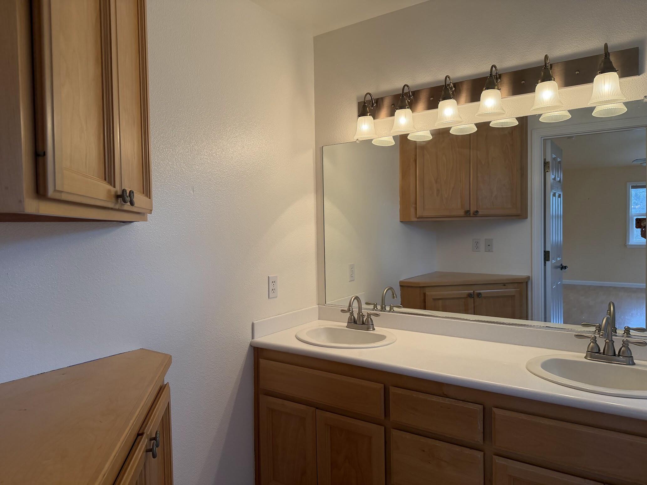 6841 Vista Lavega Road Shingletown, CA 96088 - Photo 22 of 80 a bathroom with a sink and a mirror