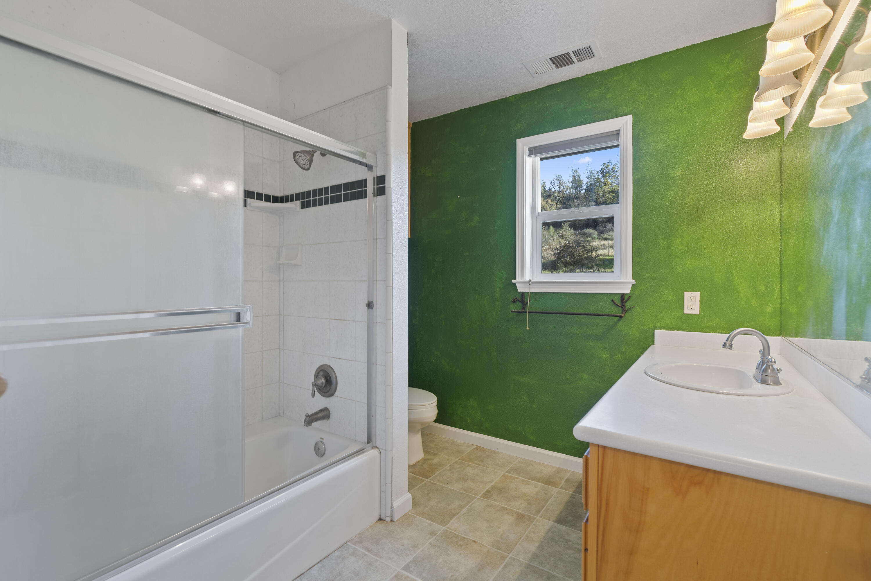 6841 Vista Lavega Road Shingletown, CA 96088 - Photo 23 of 57 a bathroom with a sink mirror toilet and bathtub
