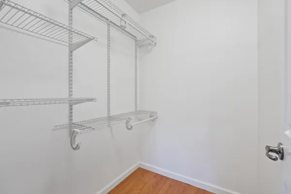 an aerial view of a house with a garden and a yard