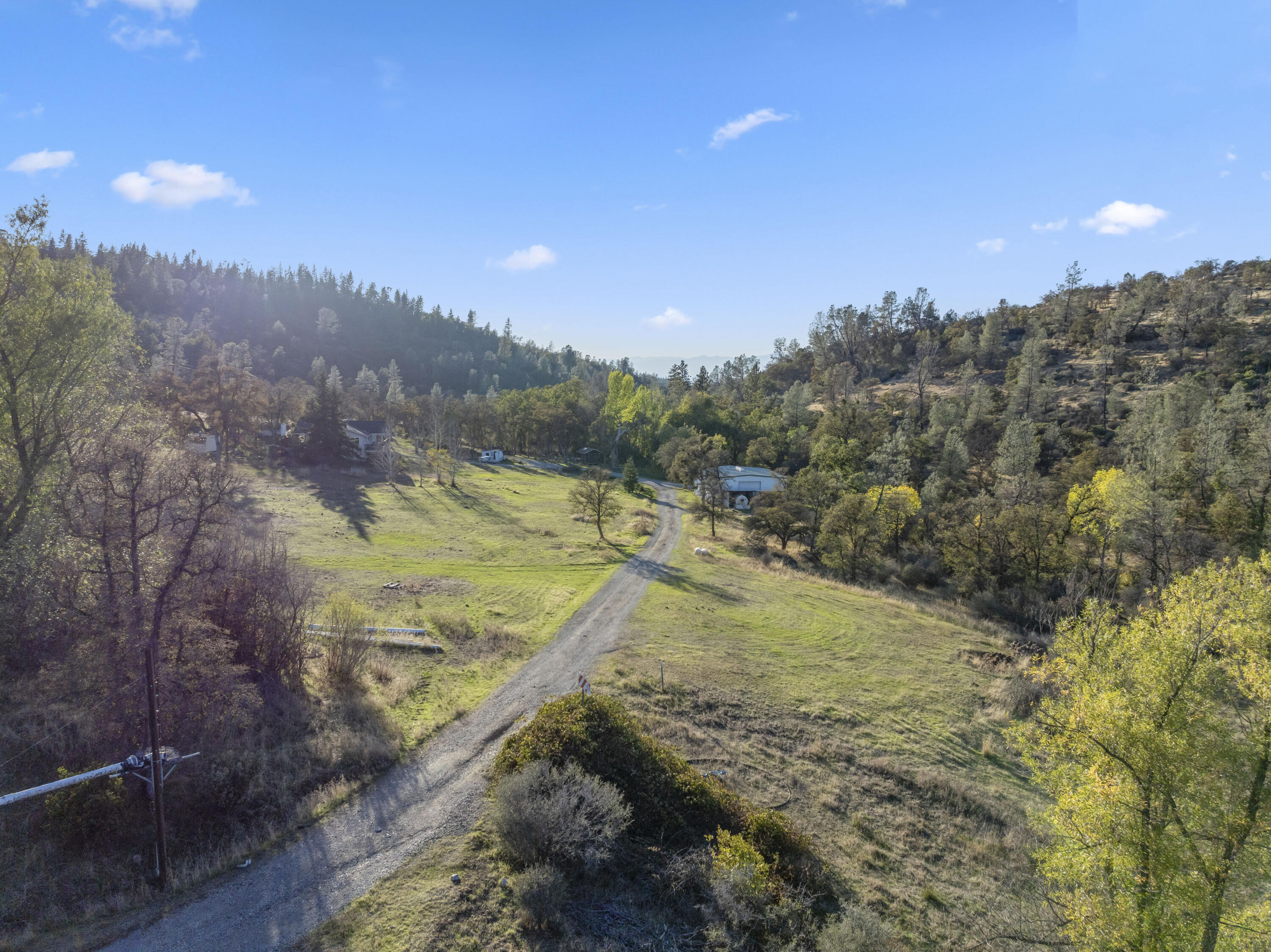 6841 Vista Lavega Road Shingletown, CA 96088 - Photo 49 of 57 a view of a yard with mountains in the background