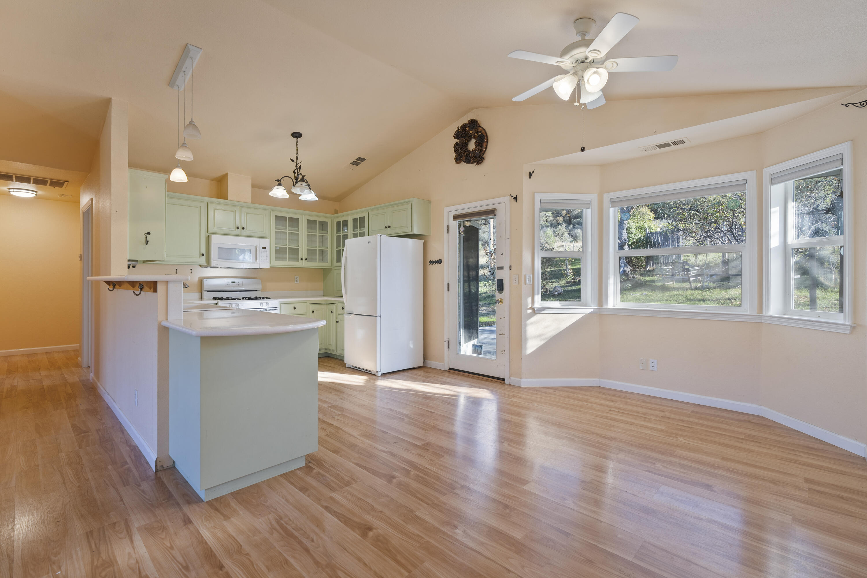 6841 Vista Lavega Road Shingletown, CA 96088 - Photo 9 of 57 a view of kitchen with stainless steel appliances granite countertop cabinets and wooden floor