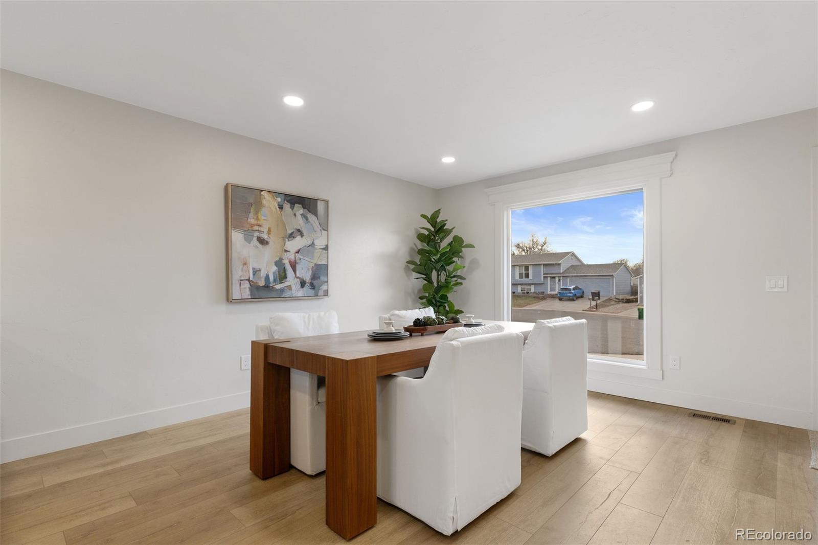 9458 Flower Street Broomfield, CO 80021 - Photo 12 of 30 a living room with furniture and a table