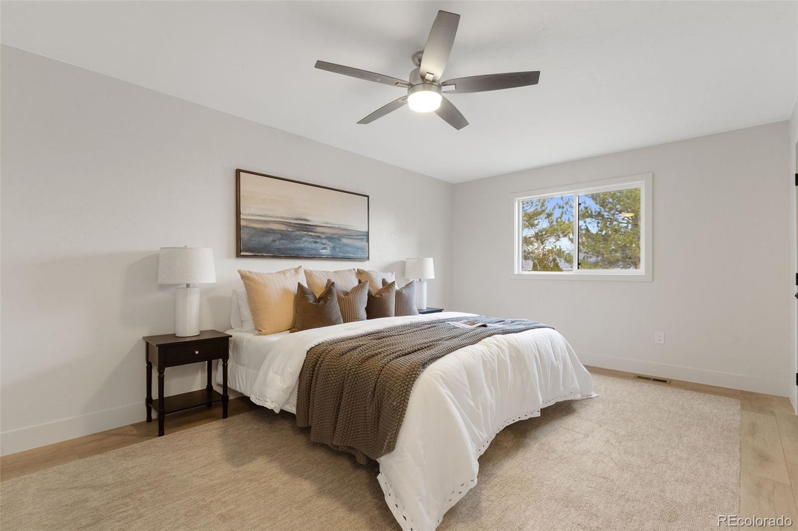 9458 Flower Street Broomfield, CO 80021 - Photo 17 of 30 a bedroom with bed and a window