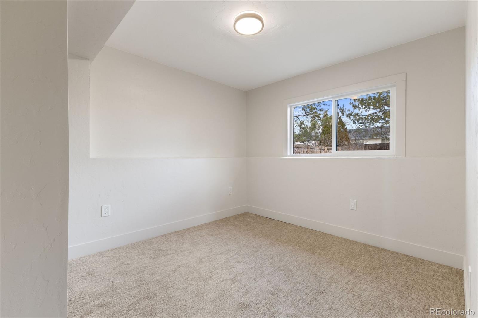 9458 Flower Street Broomfield, CO 80021 - Photo 23 of 30 an empty room with a window