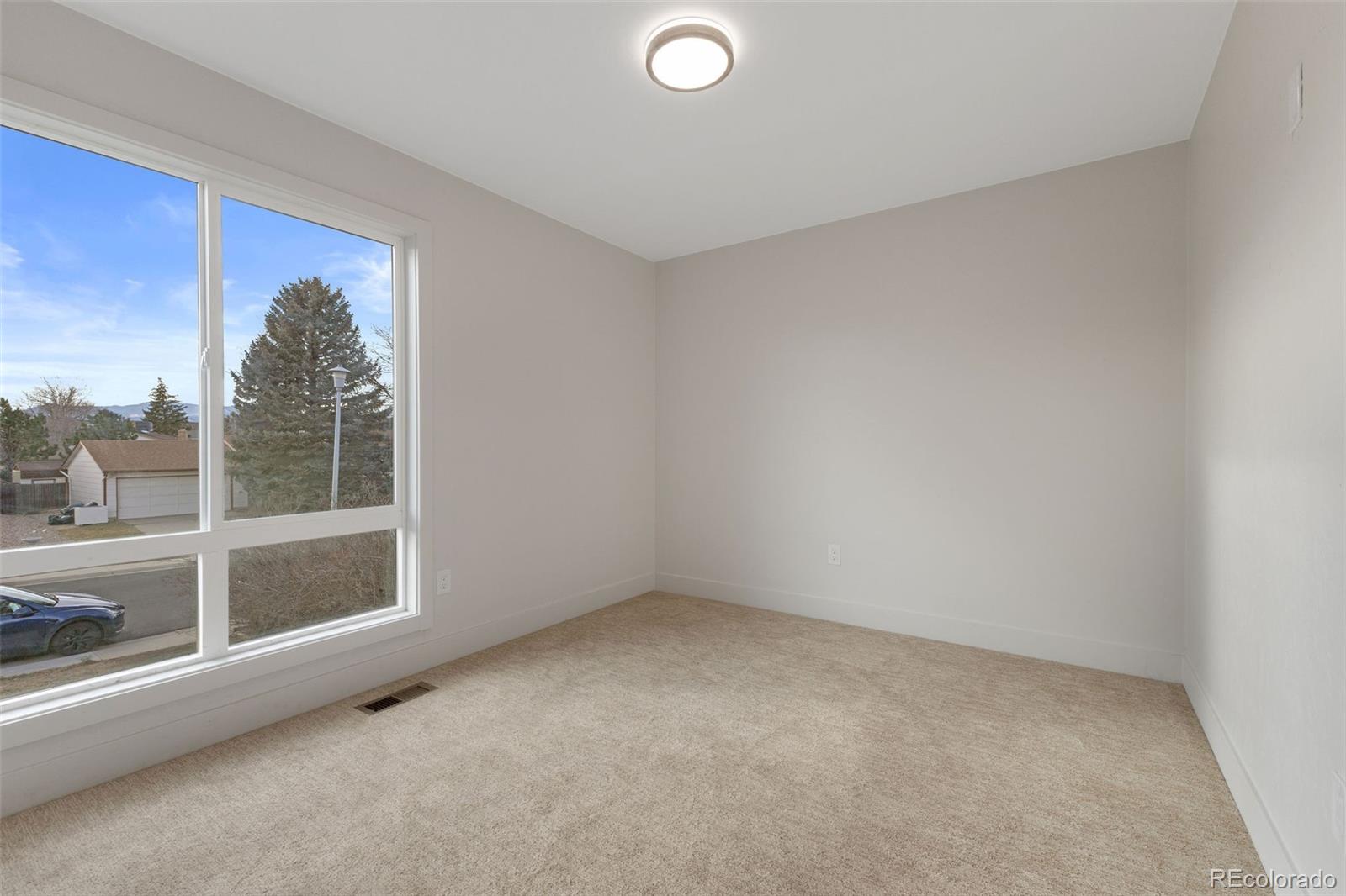 9458 Flower Street Broomfield, CO 80021 - Photo 25 of 30 an empty room with a window