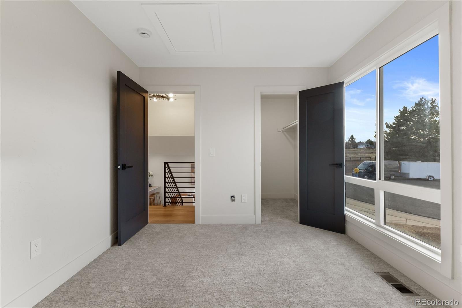 9458 Flower Street Broomfield, CO 80021 - Photo 26 of 30 a view of an empty room with a window
