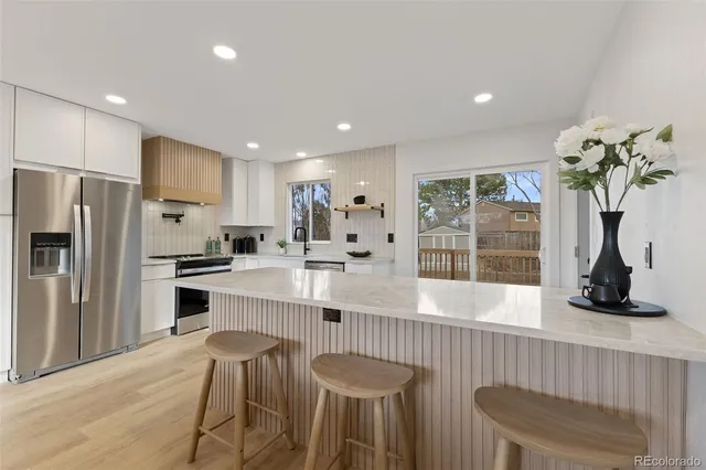 a bathroom with a toilet a sink and bathtub