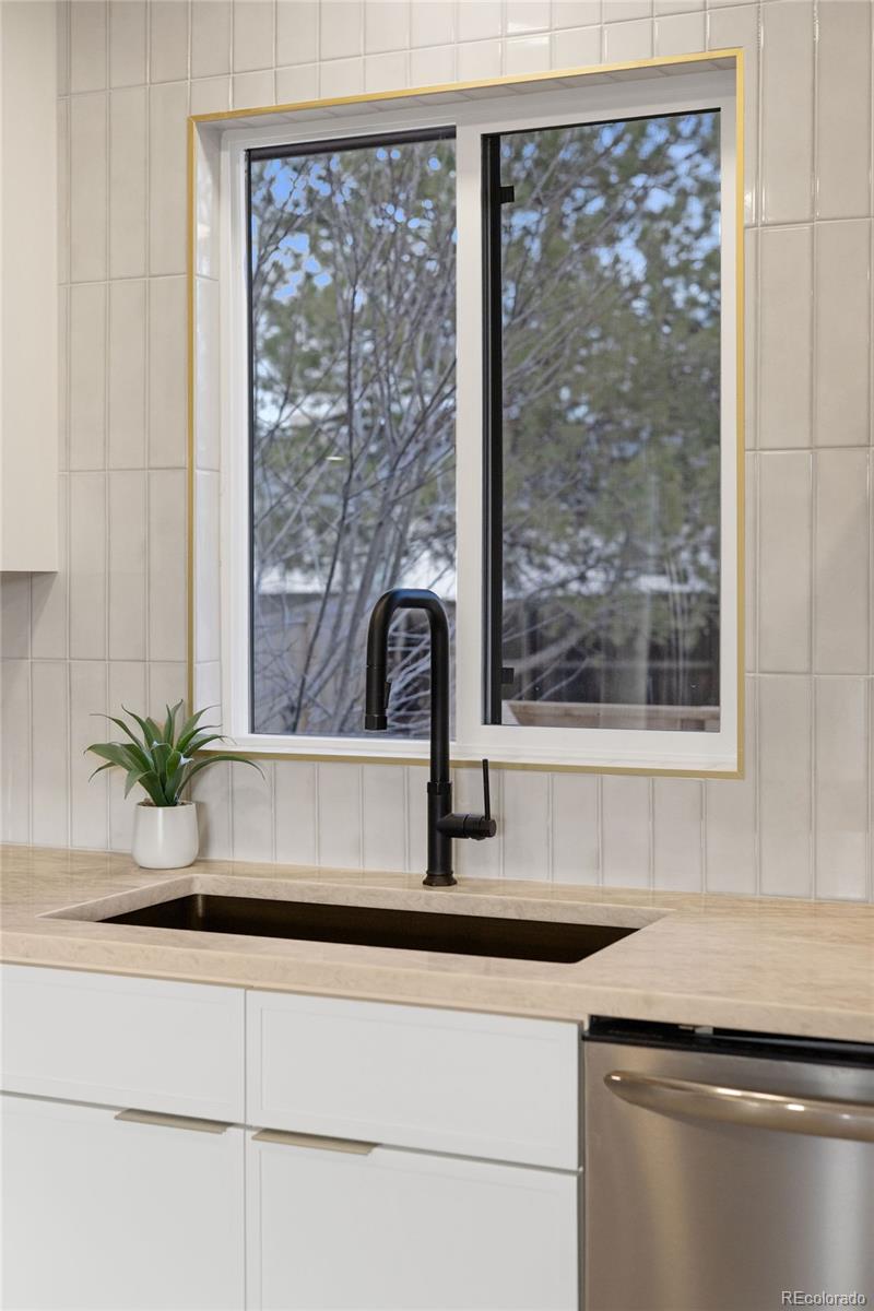 9458 Flower Street Broomfield, CO 80021 - Photo 10 of 30 a kitchen with a sink and large window
