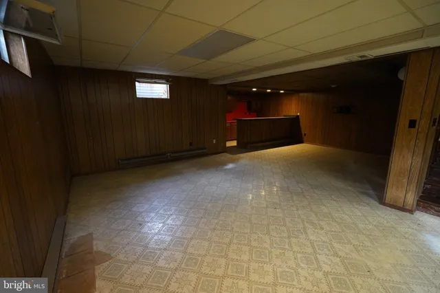 a view of an empty room with storage