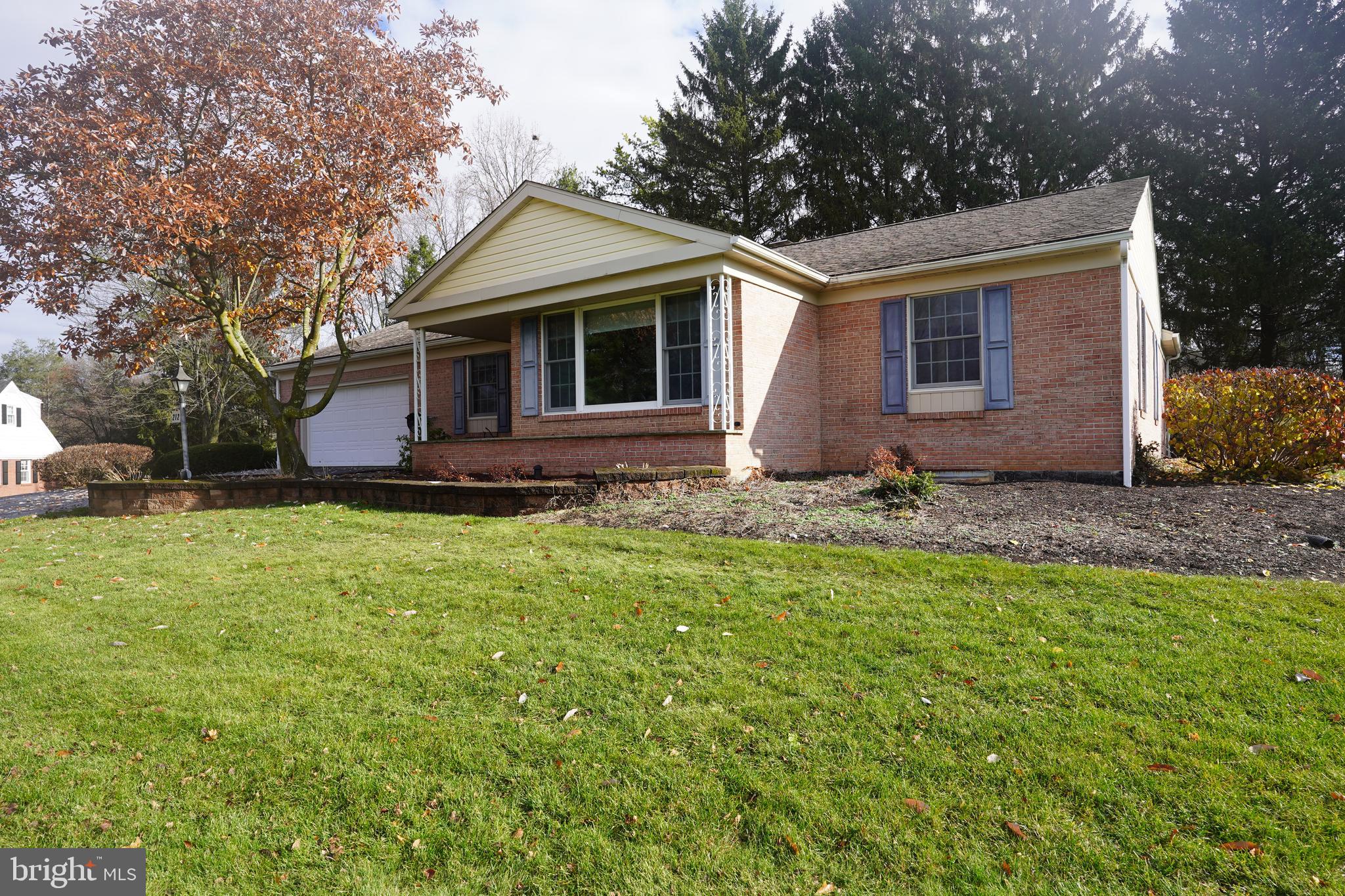 212 Seneca Circle State College, PA 16801 - Photo 28 of 67 a front view of house with yard and trees in the background